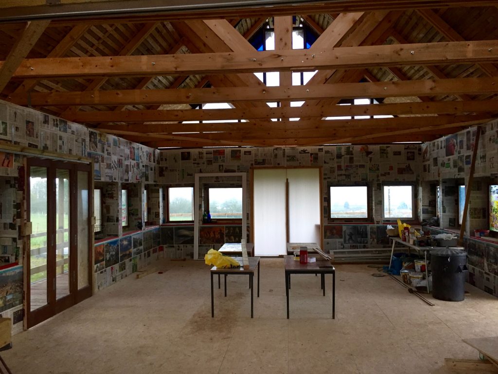 Inside the vaulted field classroom at Paddington Farm, where they have just put in the first of four sliding door, which will allow your to walk straight out onto the covered veranda that surrounds the building on three sides. Next week the carpet goes down...